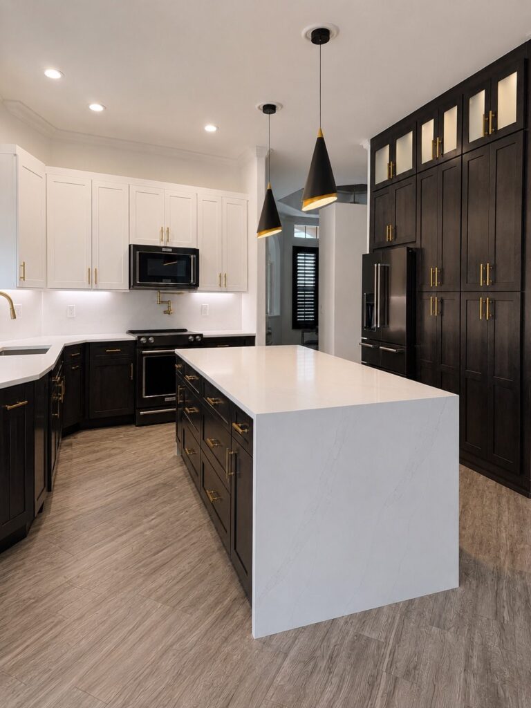 Two tone kitchen with white quartz waterfall island Two tone kitchen with white quartz waterfall island, espresso pantry wall and black cone pendants (Alliance Construction remodel, Southwest Florida)